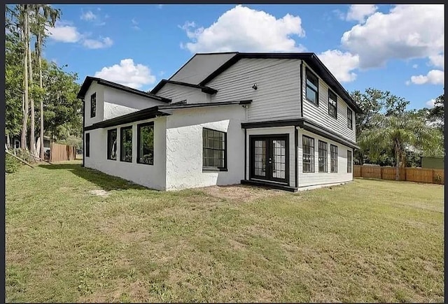 19003 Cedar Ln, Lutz, FL 33548 - rear view of property with french doors and stucco siding