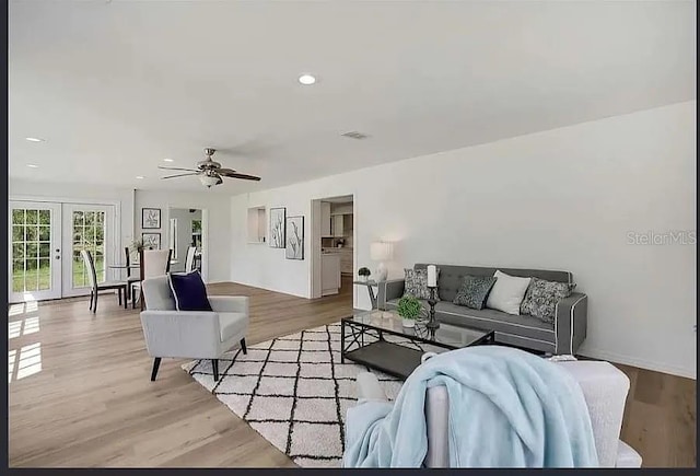 19003 Cedar Ln, Lutz, FL 33548 - living area with french doors, wood finished floors, ceiling fan, and recessed lighting