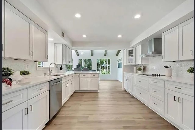 19003 Cedar Ln, Lutz, FL 33548 - kitchen with dishwasher, wall chimney exhaust hood, a peninsula, white cabinets, and recessed lighting