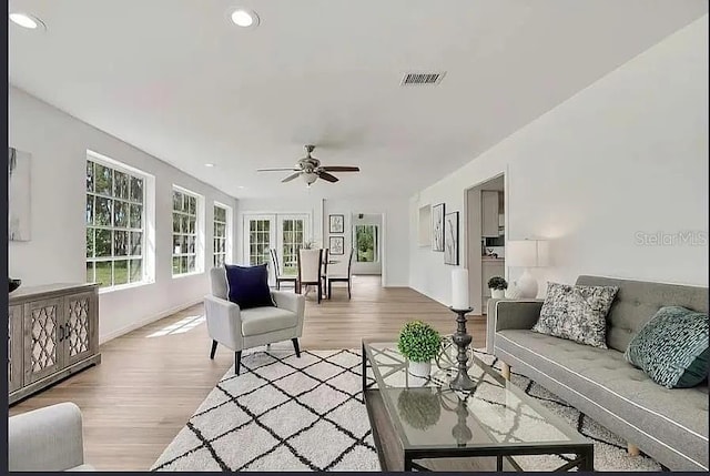 19003 Cedar Ln, Lutz, FL 33548 - living room with ceiling fan, healthy amount of natural light, light wood-style floors, and recessed lighting