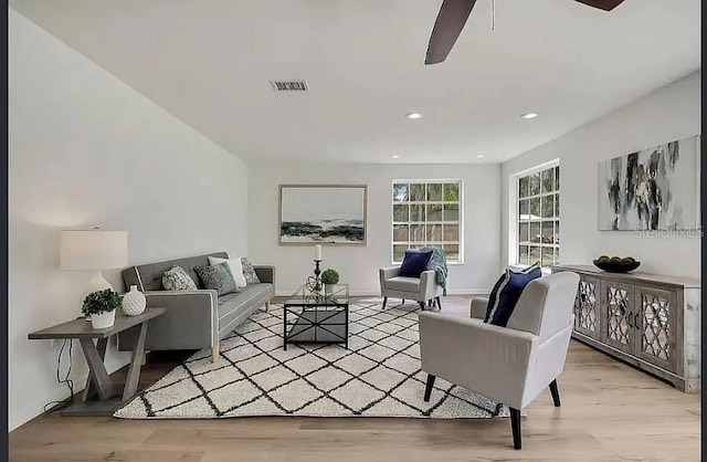19003 Cedar Ln, Lutz, FL 33548 - living area with wood finished floors, a ceiling fan, and recessed lighting