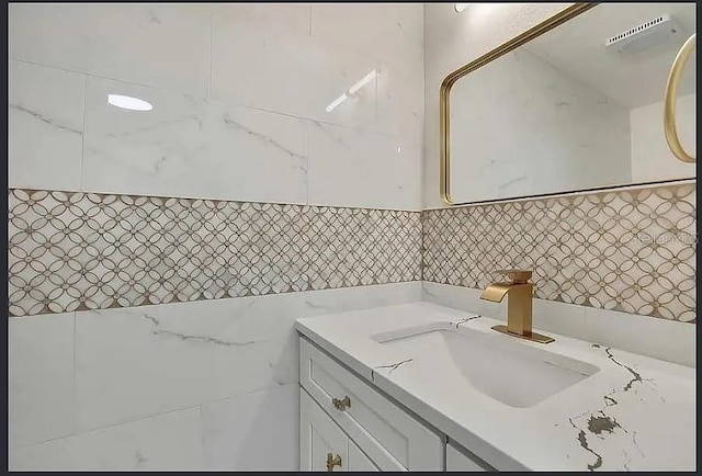 19003 Cedar Ln, Lutz, FL 33548 - bathroom with tile walls and vanity