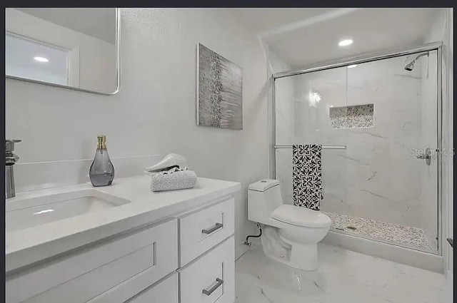 19003 Cedar Ln, Lutz, FL 33548 - bathroom with a shower stall, marble finish floors, vanity, and recessed lighting