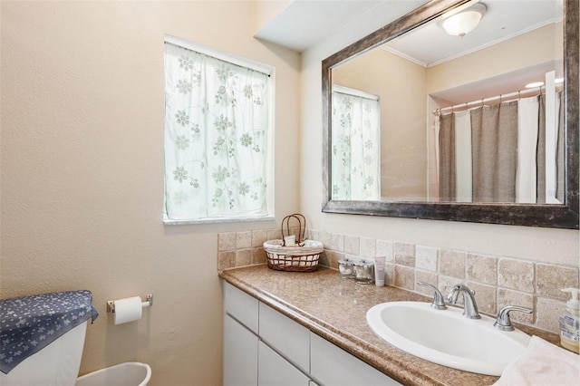 14803 Tulip Dr, Tampa, FL 33613 - full bath featuring vanity, decorative backsplash, and crown molding