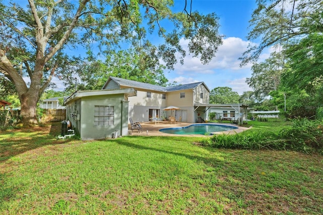 14803 Tulip Dr, Tampa, FL 33613 - rear view of house with french doors, an outdoor pool, and a patio