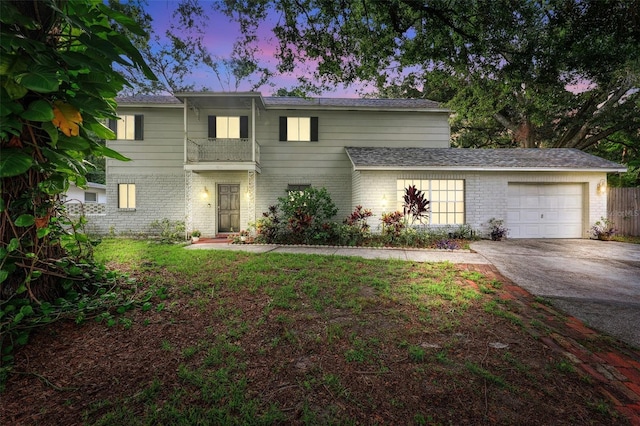 14803 Tulip Dr, Tampa, FL 33613 - view of front of home with brick siding, an attached garage, and driveway
