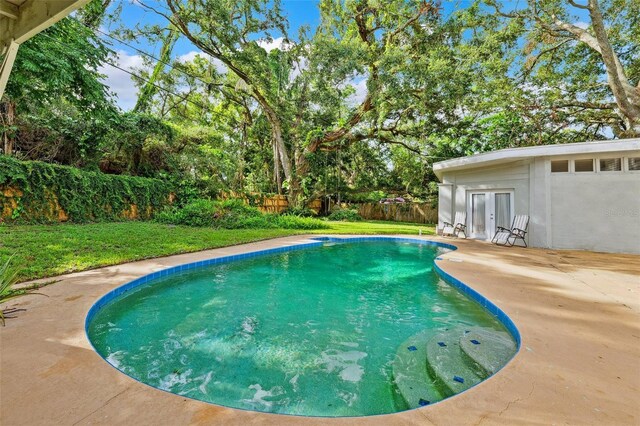 14803 Tulip Dr, Tampa, FL 33613 - view of pool with french doors, a patio, and a fenced backyard