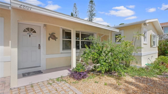 2807 Miriam St S, Gulfport, FL 33711 - view of exterior entry featuring stucco siding