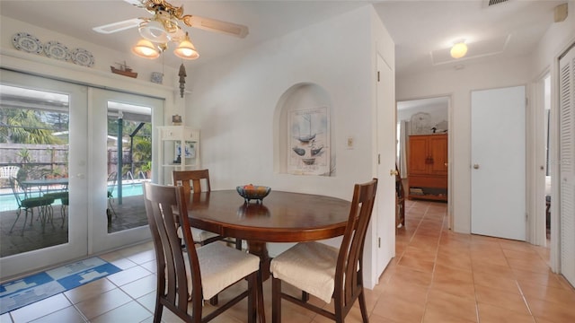2807 Miriam St S, Gulfport, FL 33711 - dining area featuring light tile patterned floors, french doors, and ceiling fan