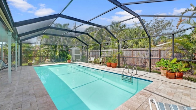 2807 Miriam St S, Gulfport, FL 33711 - view of pool with a shed, a patio, a fenced backyard, and glass enclosure