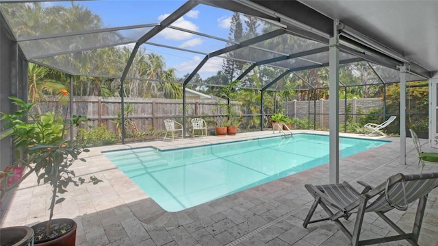 2807 Miriam St S, Gulfport, FL 33711 - view of swimming pool featuring a fenced backyard, a patio, and glass enclosure
