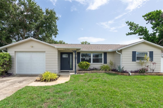 1806 11th St SW, Largo, FL 33778 - ranch-style home with concrete driveway, a garage, a front lawn, and a shingled roof