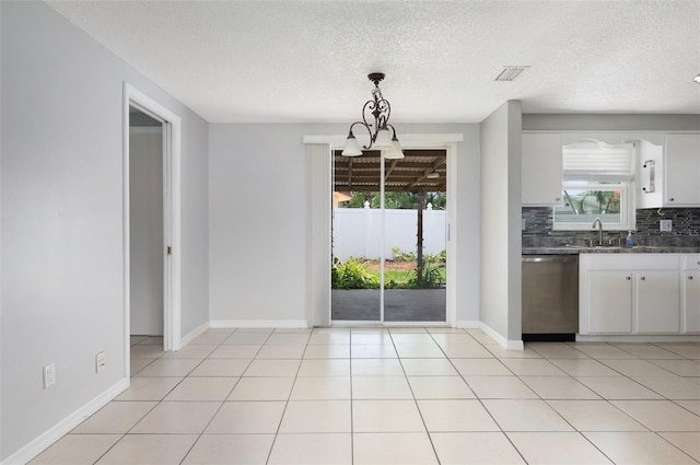 1806 11th St SW, Largo, FL 33778 - unfurnished dining area with plenty of natural light and a textured ceiling