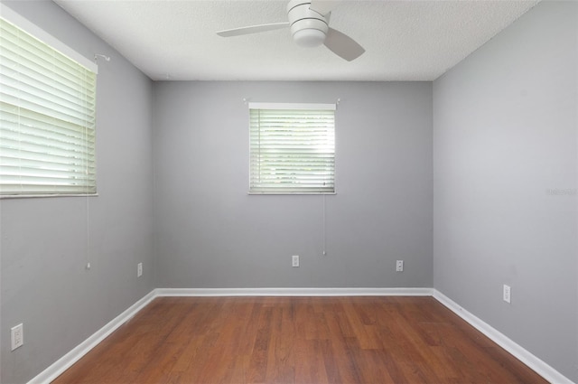 1806 11th St SW, Largo, FL 33778 - spare room featuring ceiling fan, wood finished floors, and a textured ceiling