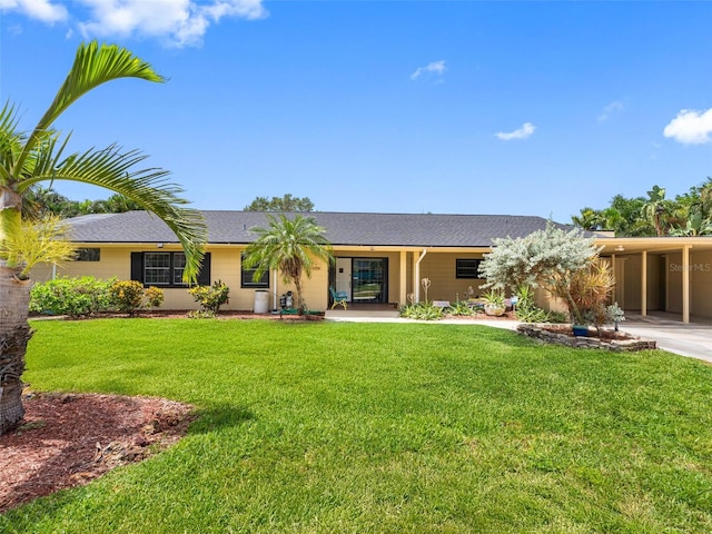 3944 49th Ave S, Saint Petersburg, FL 33711 - single story home featuring a front yard, an attached carport, and a shingled roof
