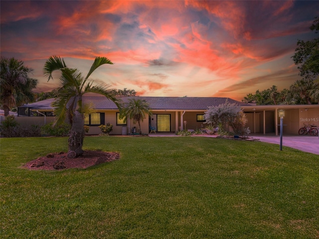 3944 49th Ave S, Saint Petersburg, FL 33711 - view of front of house featuring a front lawn, a carport, and concrete driveway