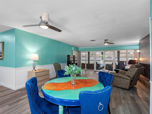 3944 49th Ave S, Saint Petersburg, FL 33711 - dining room with ceiling fan, wood finished floors, and wainscoting