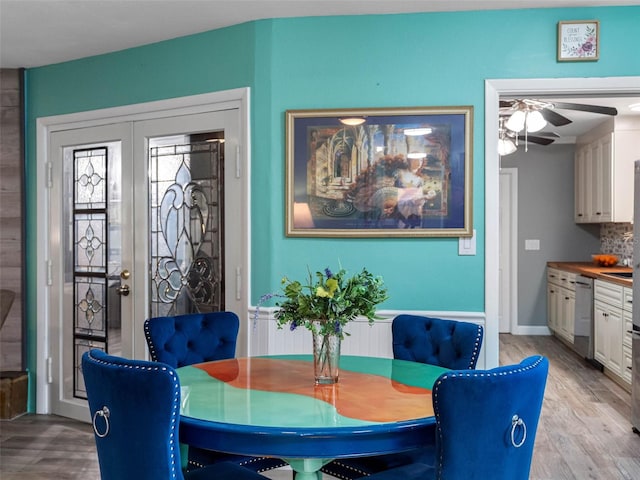 3944 49th Ave S, Saint Petersburg, FL 33711 - dining space with a ceiling fan and light wood finished floors