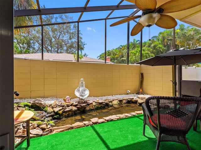 3944 49th Ave S, Saint Petersburg, FL 33711 - sunroom featuring a small pond and healthy amount of natural light