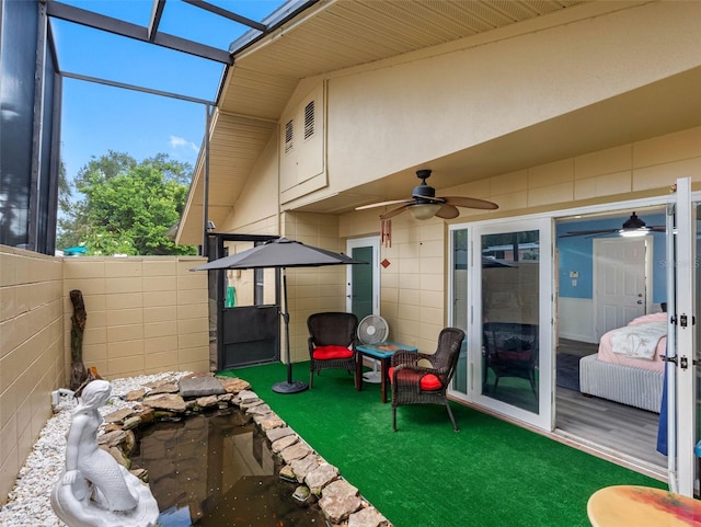 3944 49th Ave S, Saint Petersburg, FL 33711 - fenced backyard featuring ceiling fan and a lanai