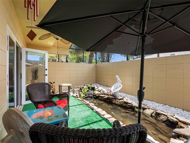 3944 49th Ave S, Saint Petersburg, FL 33711 - view of patio featuring a garden pond