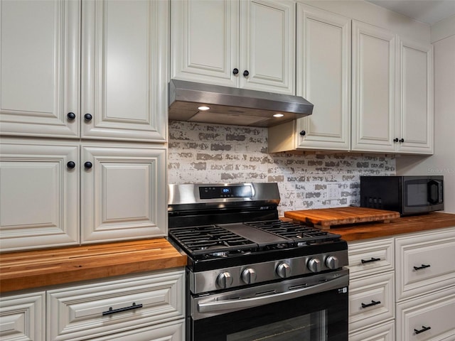 3944 49th Ave S, Saint Petersburg, FL 33711 - kitchen with butcher block counters, stainless steel range with gas cooktop, under cabinet range hood, and black microwave