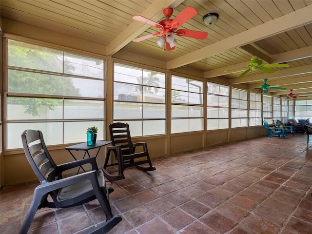 3944 49th Ave S, Saint Petersburg, FL 33711 - sunroom with a ceiling fan, stone tile flooring, and a wood ceiling with exposed beams