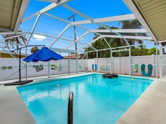 3944 49th Ave S, Saint Petersburg, FL 33711 - view of pool featuring a fenced backyard, a patio, and glass enclosure