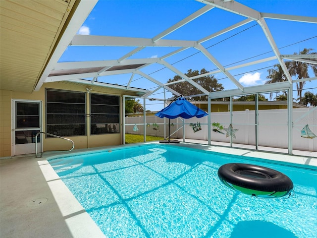 3944 49th Ave S, Saint Petersburg, FL 33711 - view of swimming pool featuring a patio and glass enclosure