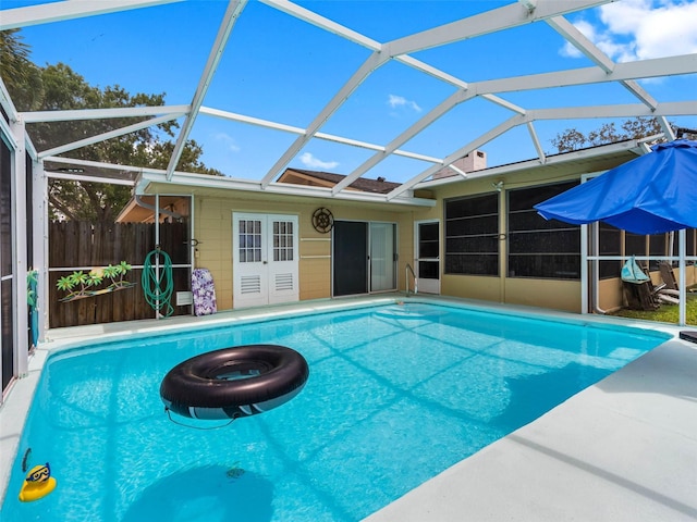 3944 49th Ave S, Saint Petersburg, FL 33711 - view of swimming pool with a lanai, french doors, and a patio area