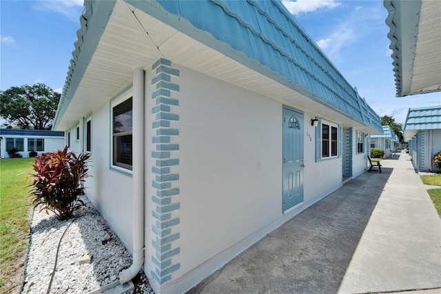 302 Andover Pl Unit G156, Sun City Center, FL 33573 - view of property exterior with stucco siding