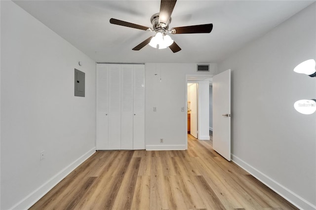 302 Andover Pl Unit G156, Sun City Center, FL 33573 - unfurnished bedroom featuring light wood-style flooring, electric panel, a closet, and a ceiling fan