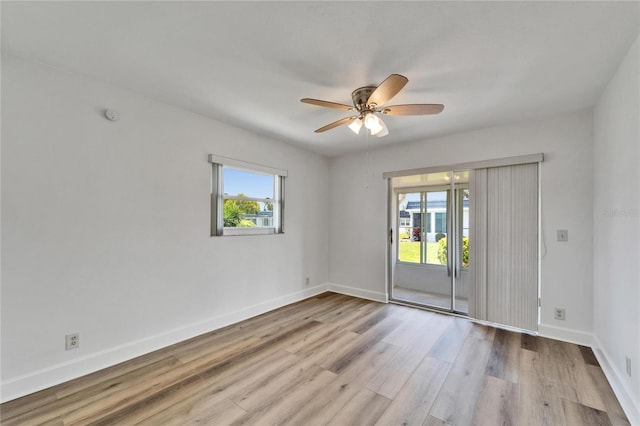 302 Andover Pl Unit G156, Sun City Center, FL 33573 - spare room featuring wood finished floors, a ceiling fan, and a smoke detector