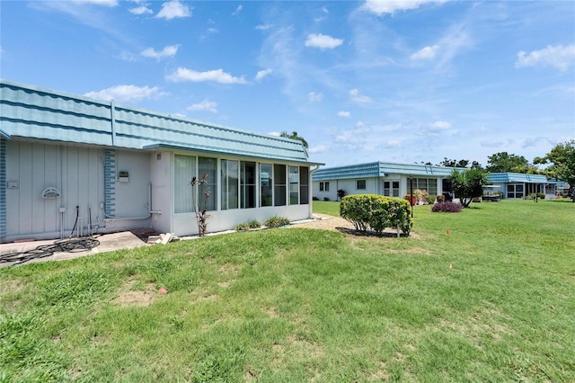 302 Andover Pl Unit G156, Sun City Center, FL 33573 - view of grassy yard with a sunroom