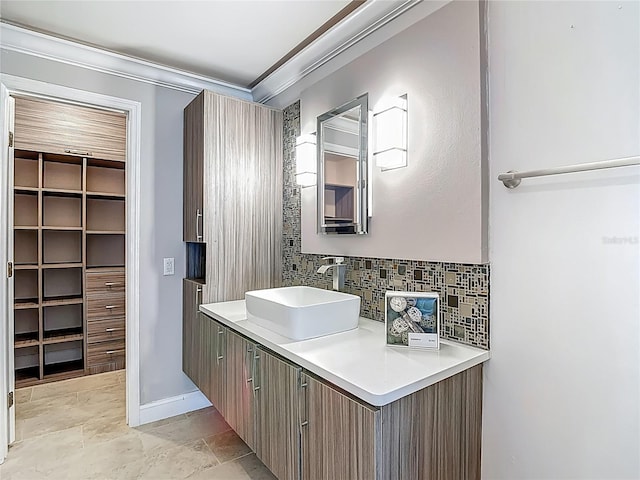 6001 Lemon Tree Ct, Tampa, FL 33625 - bathroom with decorative backsplash, ornamental molding, and vanity
