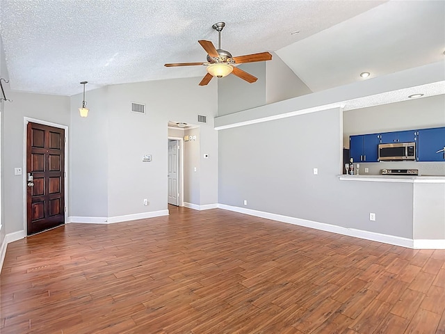 6001 Lemon Tree Ct, Tampa, FL 33625 - unfurnished living room with ceiling fan, dark wood finished floors, a textured ceiling, and high vaulted ceiling