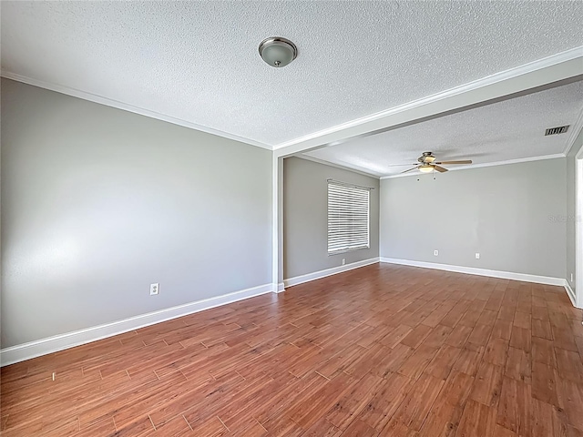 6001 Lemon Tree Ct, Tampa, FL 33625 - empty room featuring a textured ceiling, dark wood-style flooring, crown molding, and ceiling fan