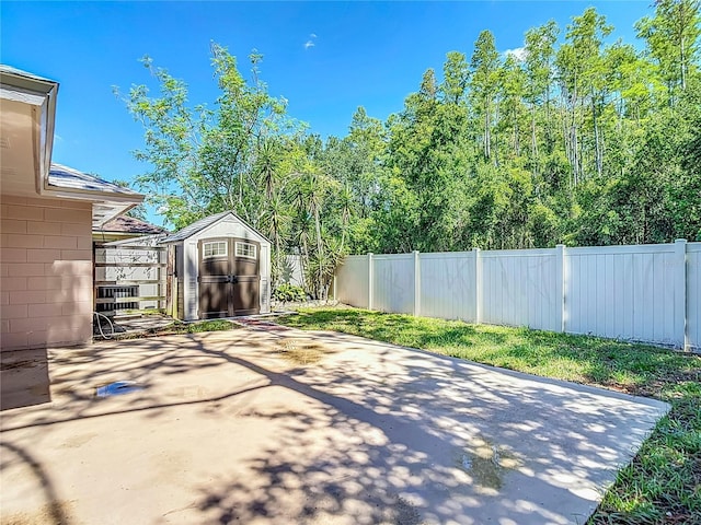 6001 Lemon Tree Ct, Tampa, FL 33625 - fenced backyard with a storage unit and a patio area
