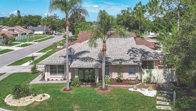 6001 Lemon Tree Ct, Tampa, FL 33625 - rear view of house with roof with shingles and stucco siding