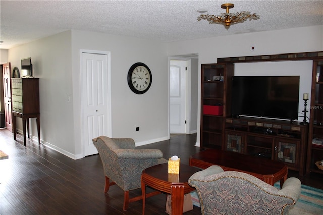 2101 Sunset Point Rd Unit 2304, Clearwater, FL 33765 - living area with a textured ceiling and wood finished floors