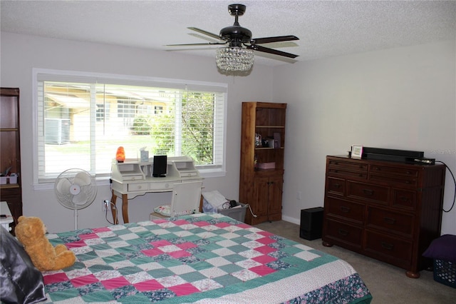 2101 Sunset Point Rd Unit 2304, Clearwater, FL 33765 - bedroom featuring light carpet, a textured ceiling, and ceiling fan
