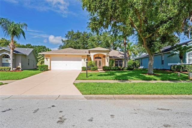 11412 Alden Ct, Hudson, FL 34667 - view of front of property with an attached garage, driveway, stucco siding, and a front yard