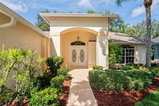 11412 Alden Ct, Hudson, FL 34667 - doorway to property with stucco siding