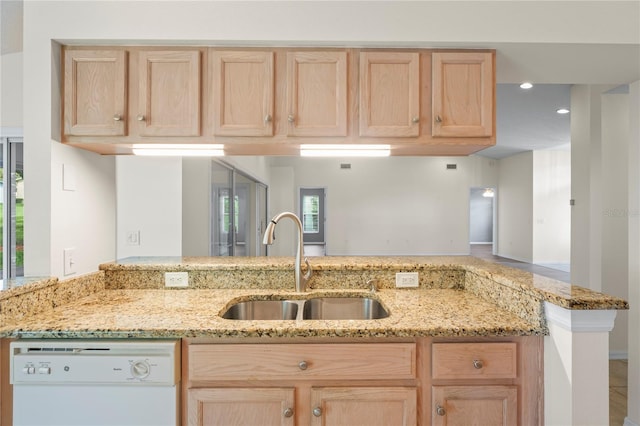 11412 Alden Ct, Hudson, FL 34667 - kitchen with dishwasher, light brown cabinetry, and light stone counters