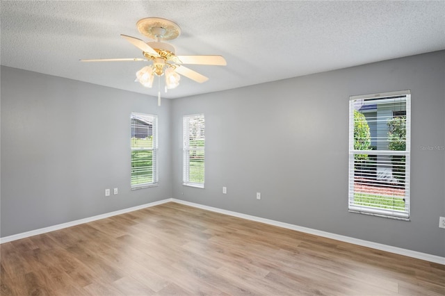 11412 Alden Ct, Hudson, FL 34667 - empty room featuring light wood-type flooring, a textured ceiling, and ceiling fan