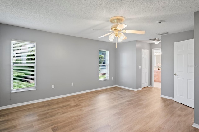 11412 Alden Ct, Hudson, FL 34667 - empty room featuring ceiling fan, light wood-style flooring, a textured ceiling, and a smoke detector