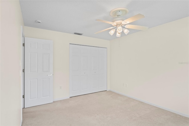 11412 Alden Ct, Hudson, FL 34667 - unfurnished bedroom with carpet floors, a closet, and ceiling fan