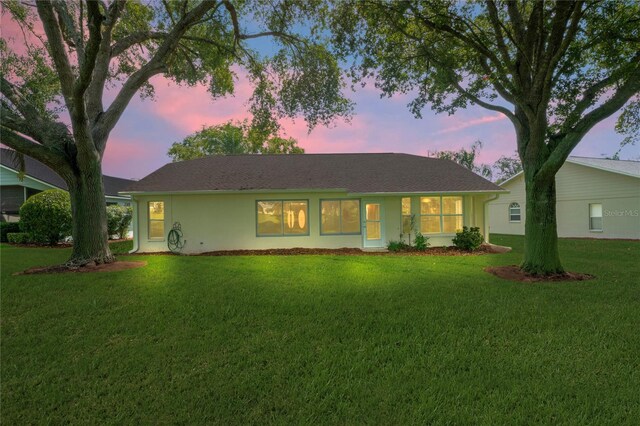 11412 Alden Ct, Hudson, FL 34667 - ranch-style house featuring a lawn and stucco siding