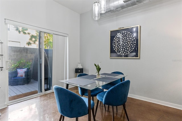 851 3rd Ave N, Saint Petersburg, FL 33701 - dining space featuring finished concrete flooring and baseboards