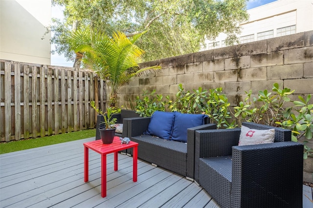 851 3rd Ave N, Saint Petersburg, FL 33701 - wooden terrace featuring a fenced backyard and an outdoor hangout area